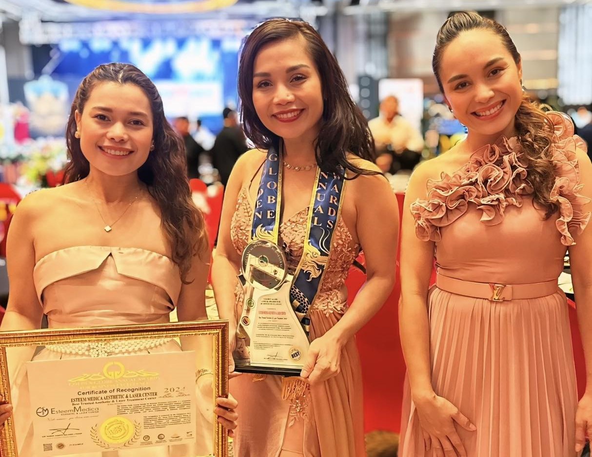 Esteem Medica receiving Golden Globe Award on stage